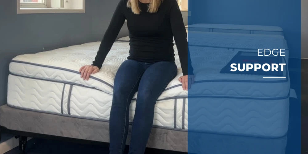 Person sitting on the edge of a Premier Hybrid mattress demonstrating edge support.