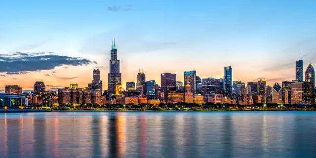 Chicago city skyline at dusk from the water.