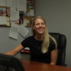 Jeanette Pullan working diligently at her desk in the office.