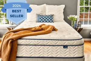 Best selling hybrid mattress of 2024 in bedroom with pillows and blanket.
