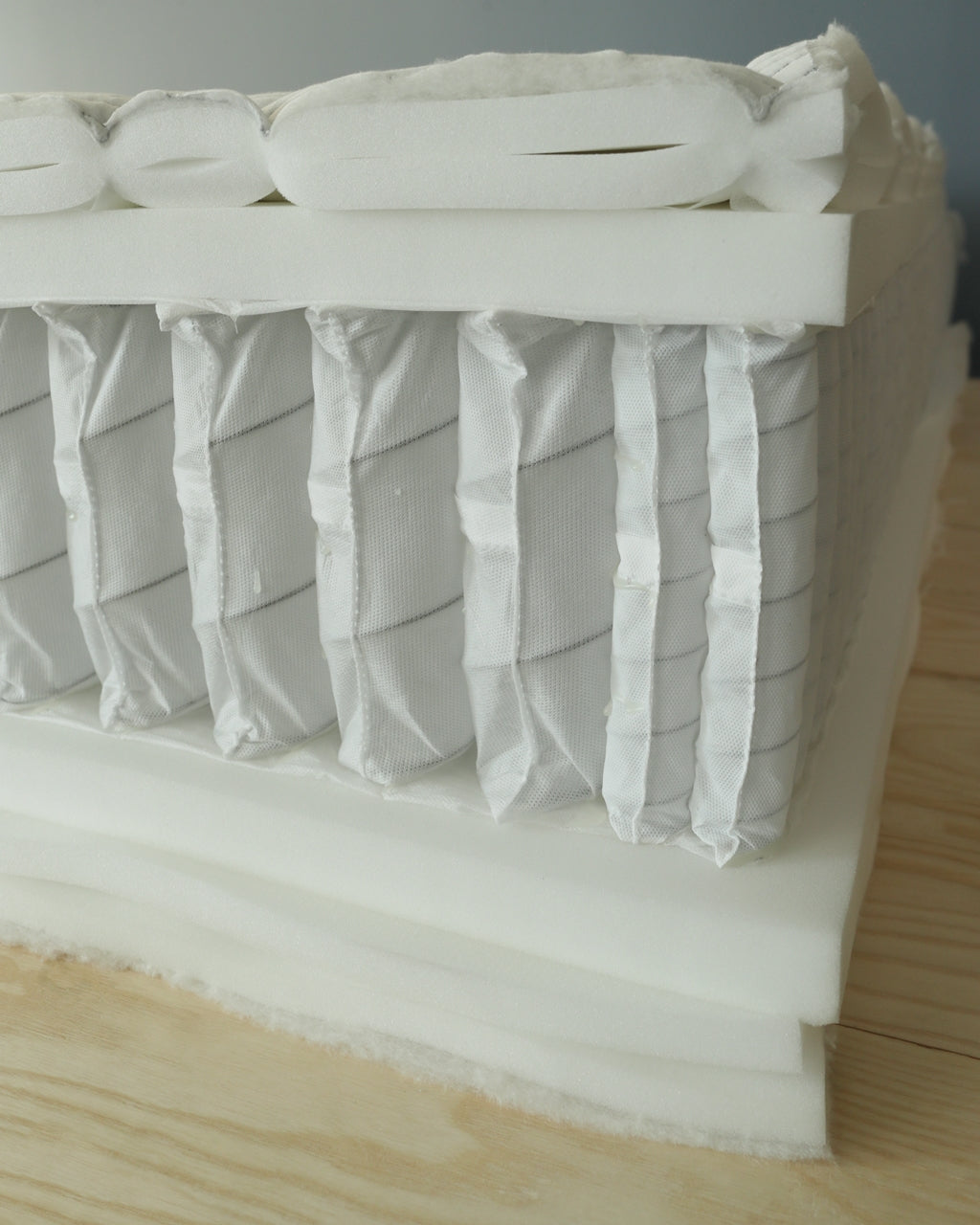 Cross section of DLX mattress highlighting quality materials and manufacturing transparency