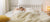 Girl sleeping in a peaceful room with DLX mattress 120-night trial badge