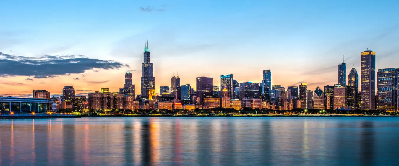 Chicago city skyline at dusk from the water.